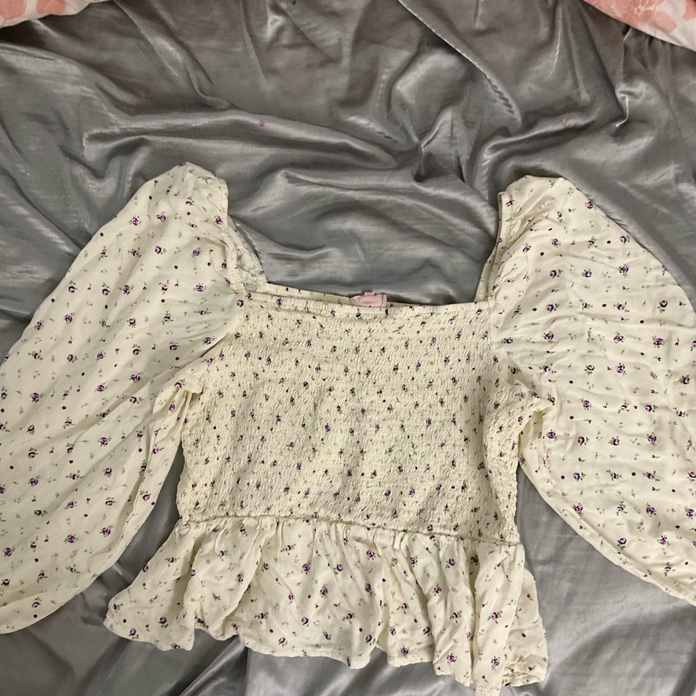 Cream Smocked Blouse with Flutter Sleeves and Ruffled Peplum